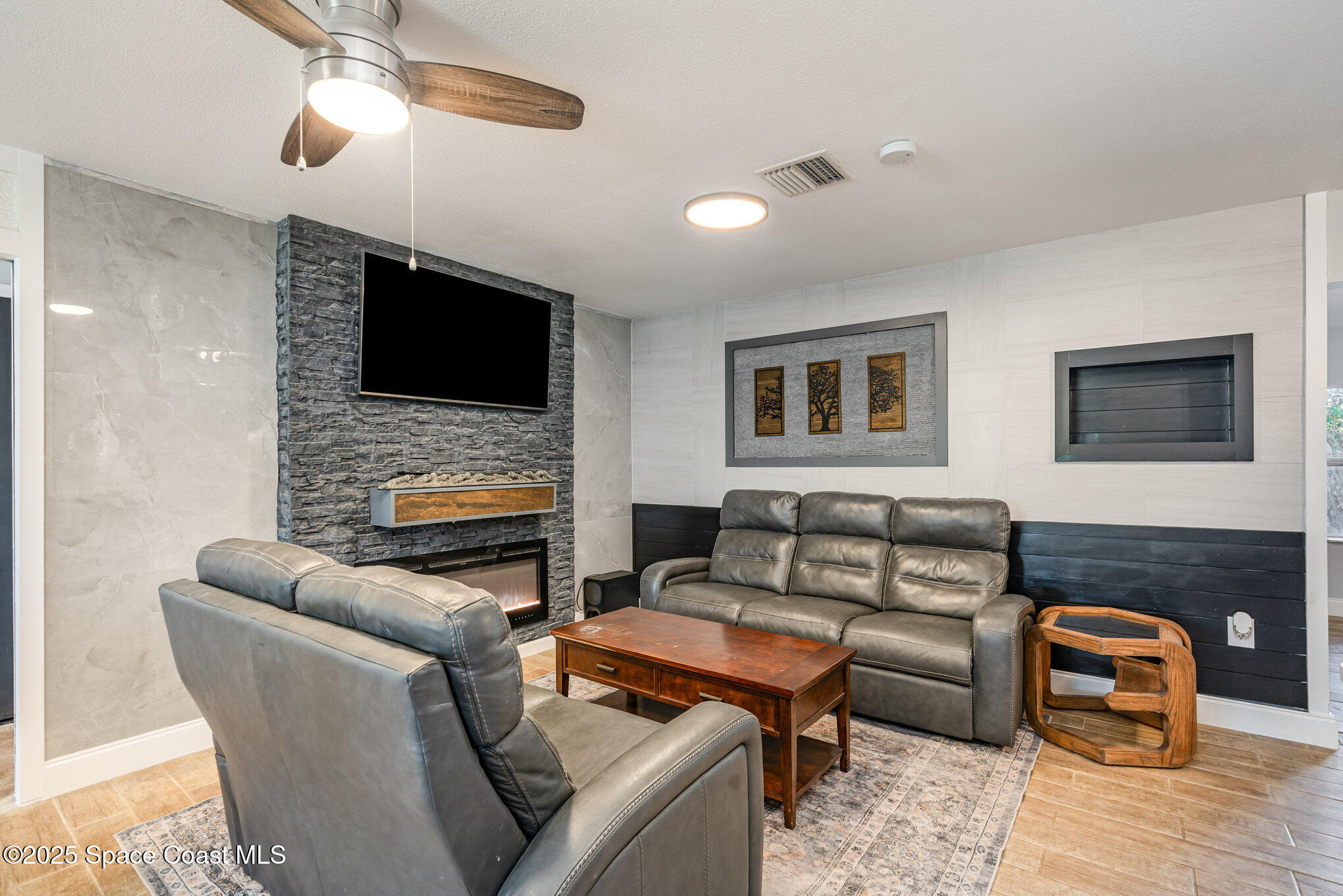 508 Comanche Avenue Melbourne, FL 32935 - Photo 6 of 21 a living room with furniture and a flat screen tv