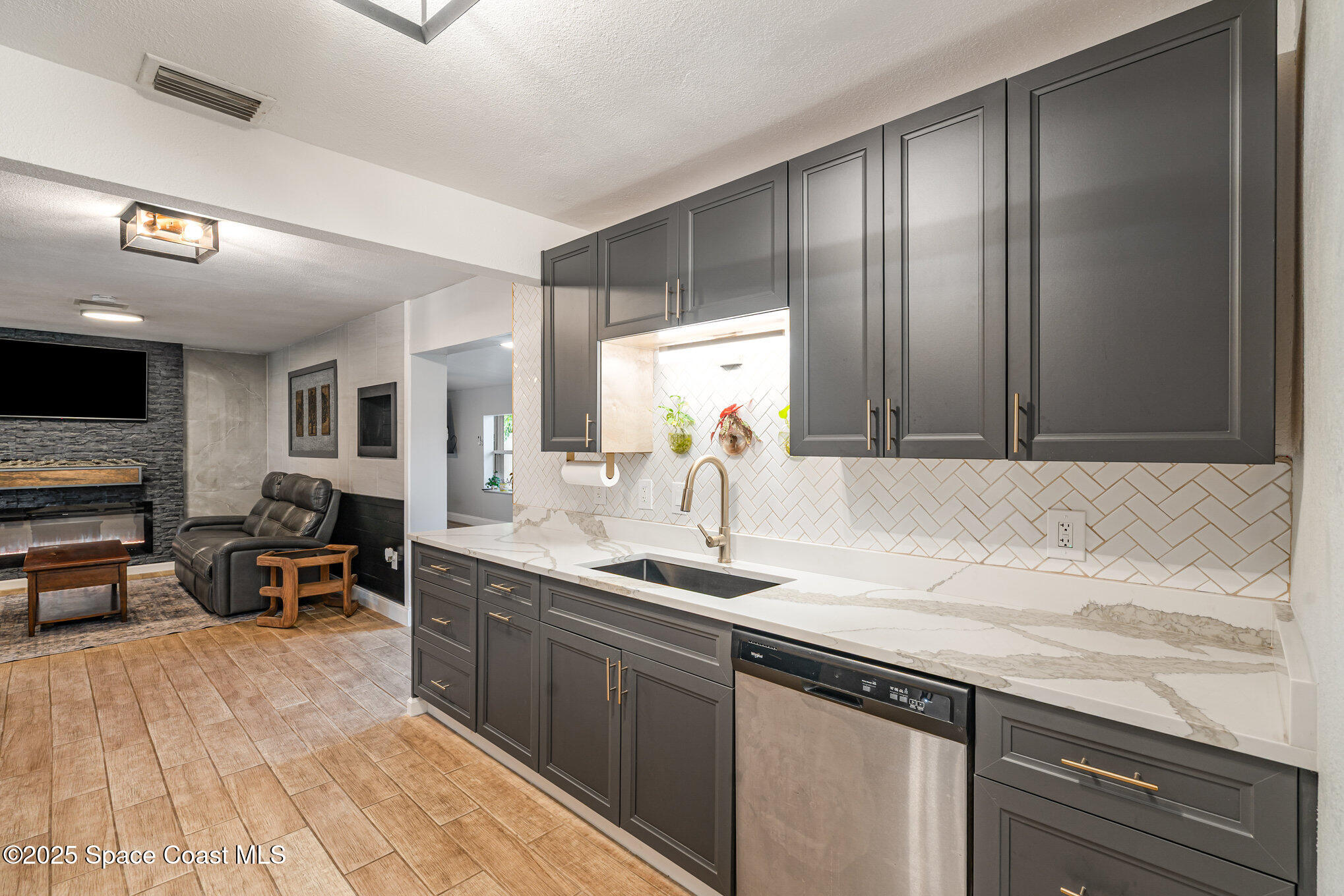 508 Comanche Avenue Melbourne, FL 32935 - Photo 8 of 21 a spacious bathroom with a granite countertop sink and a mirror
