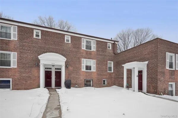a front view of a house with yard