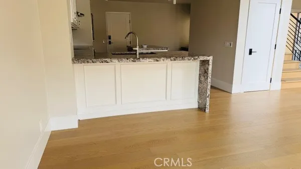 a view of a kitchen with a sink