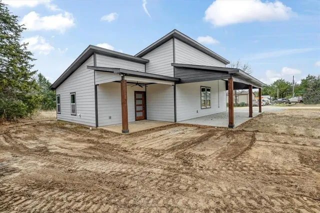 a view of a house with a yard and garage