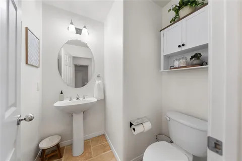 a bathroom with a double vanity sink a mirror and a shower