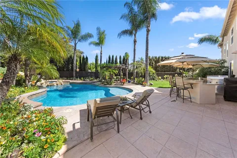 a view of a swimming pool with a patio