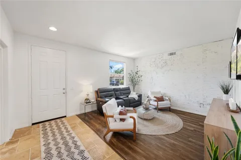 a living room with furniture and a rug