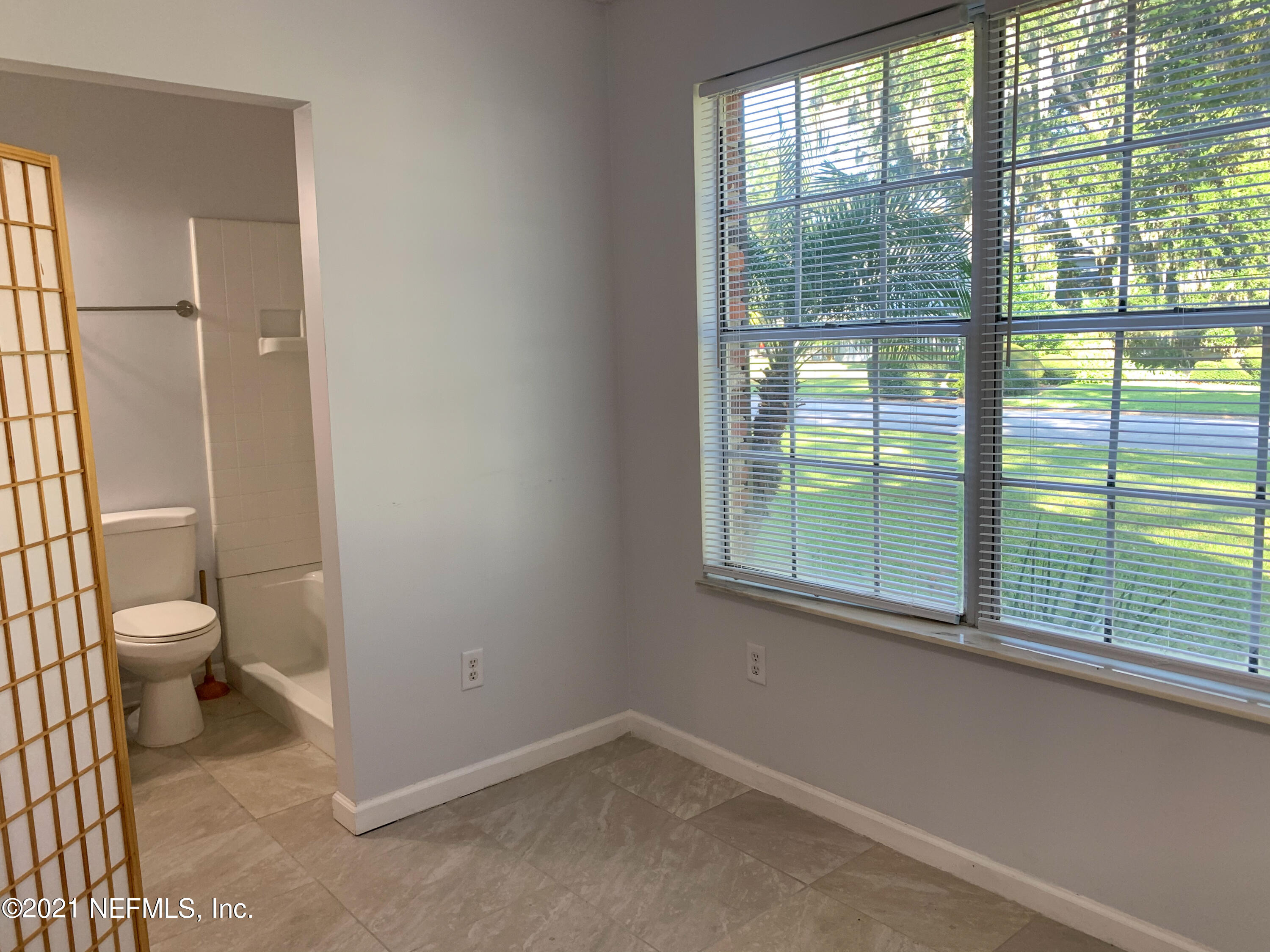 3952 Heath Road Jacksonville, FL 32277 - Photo 54 of 66 a bathroom with a toilet