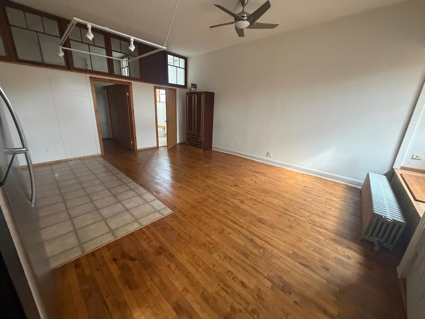 1014 East Prairie Avenue, Unit 1FE Des Plaines, IL 60016 - Photo 5 of 10 wooden floor in an empty room