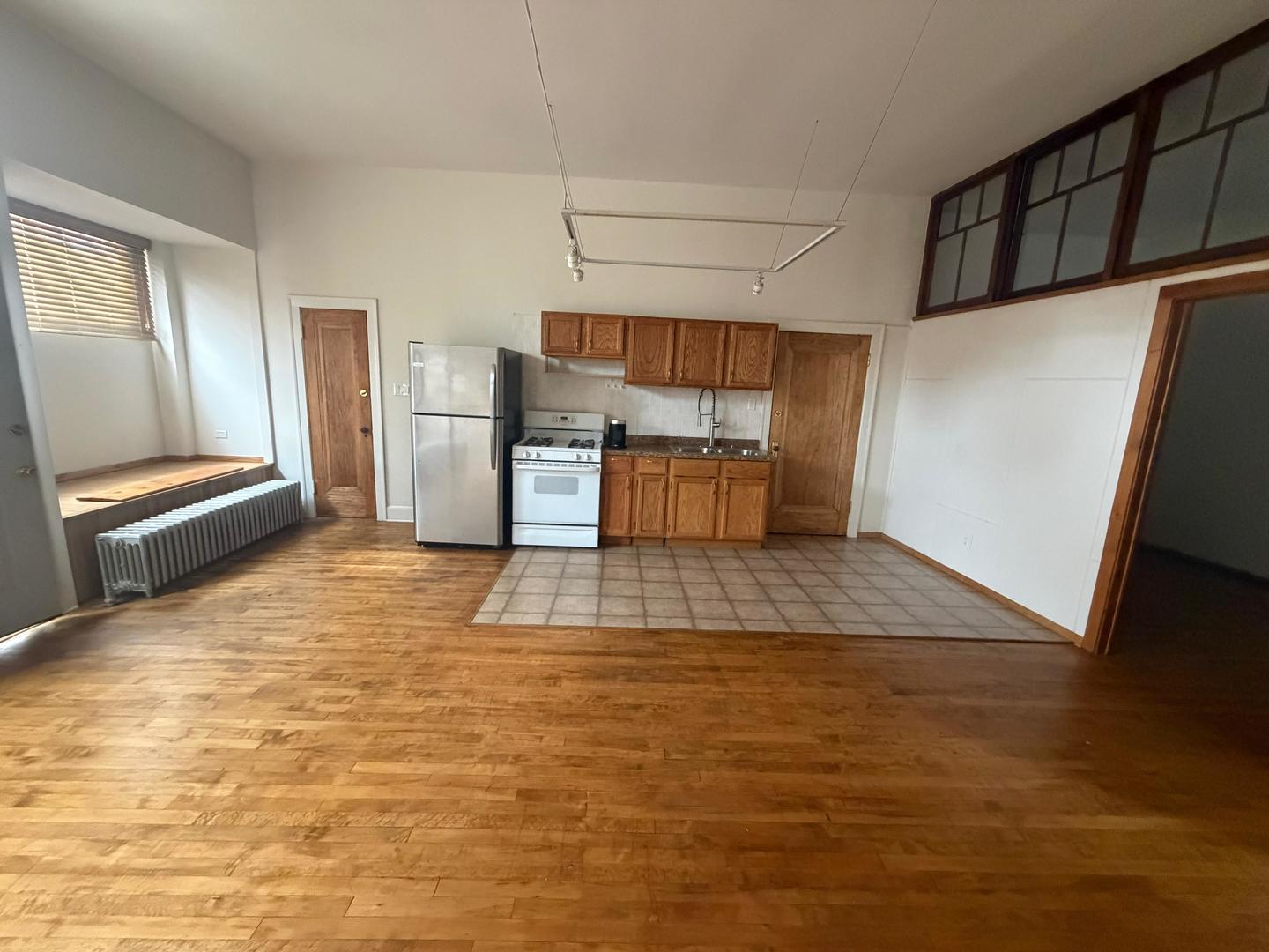 1014 East Prairie Avenue, Unit 1FE Des Plaines, IL 60016 - Photo 7 of 10 a view of kitchen with furniture and wooden floor