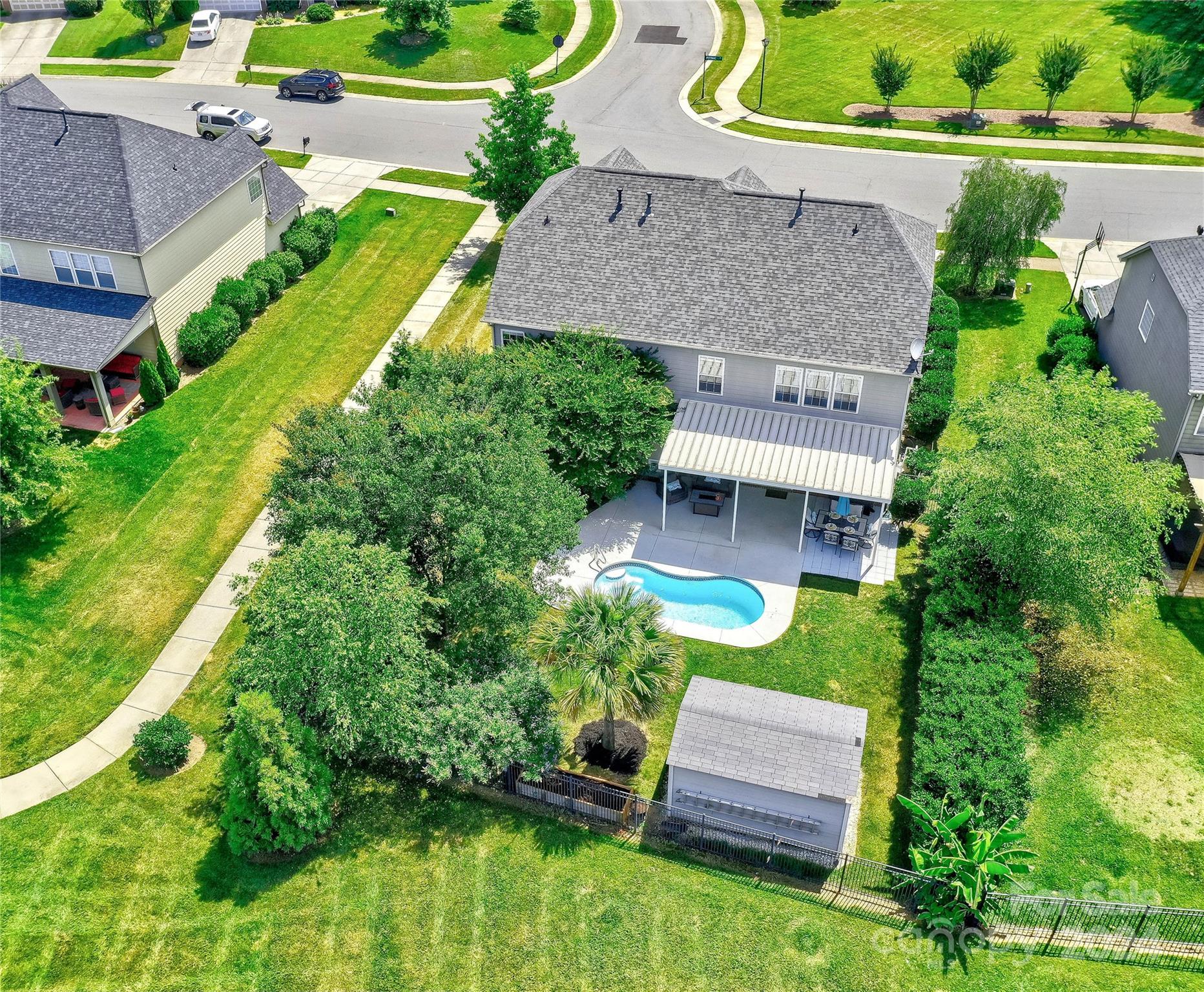 3002 Potomac Road Indian Trail, NC 28079 - Photo 2 of 48 an aerial view of a house with a garden and swimming pool