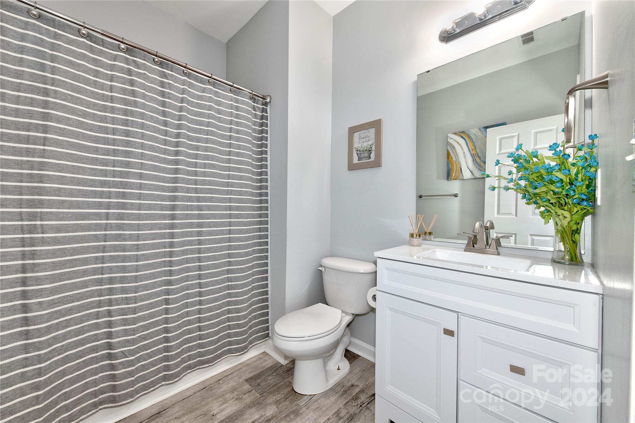 3002 Potomac Road Indian Trail, NC 28079 - Photo 21 of 48 a bathroom with a toilet a sink and mirror