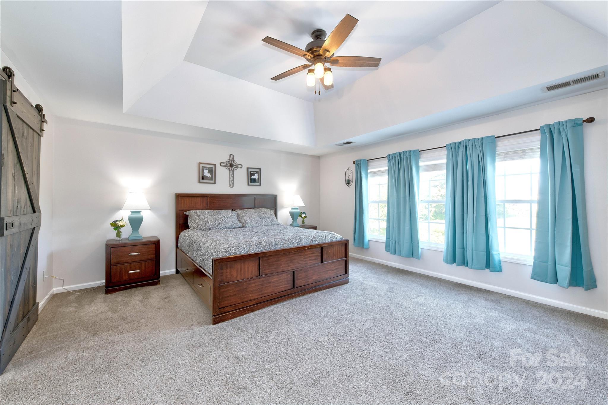 3002 Potomac Road Indian Trail, NC 28079 - Photo 26 of 48 a spacious bedroom with a bed and a large window