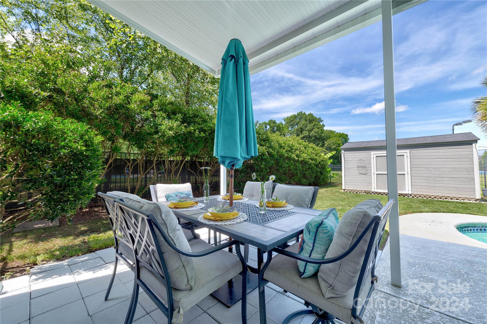 3002 Potomac Road Indian Trail, NC 28079 - Photo 42 of 48 a view of a patio with a table chairs and a table