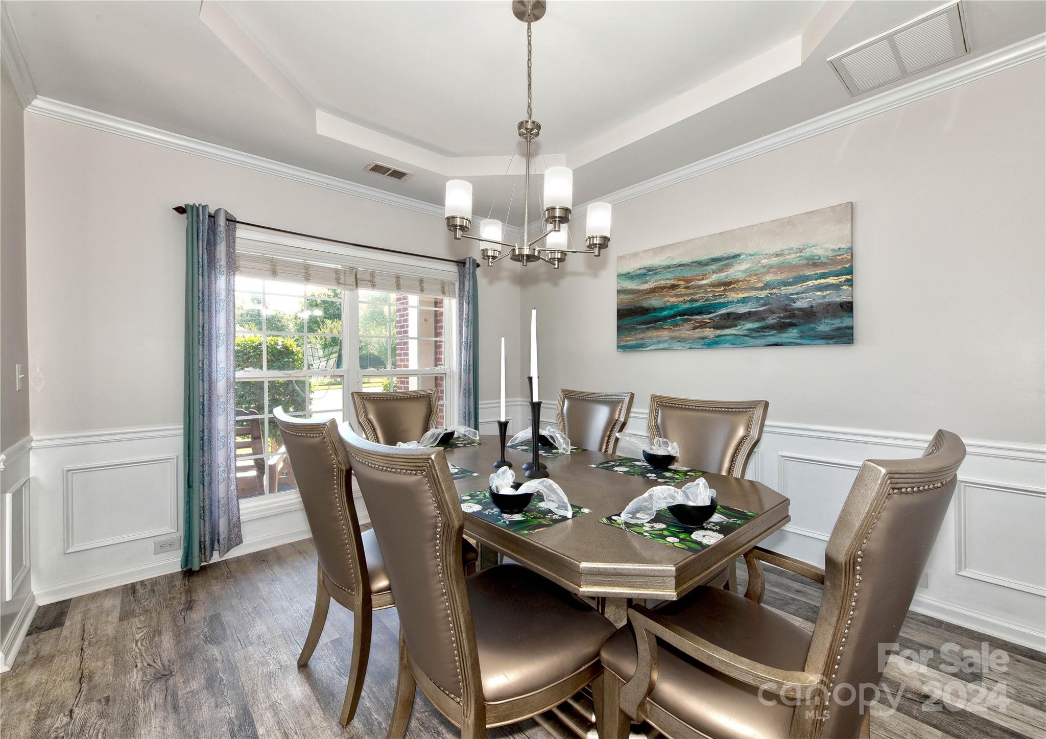 3002 Potomac Road Indian Trail, NC 28079 - Photo 7 of 48 a dining room with furniture a chandelier and wooden floor