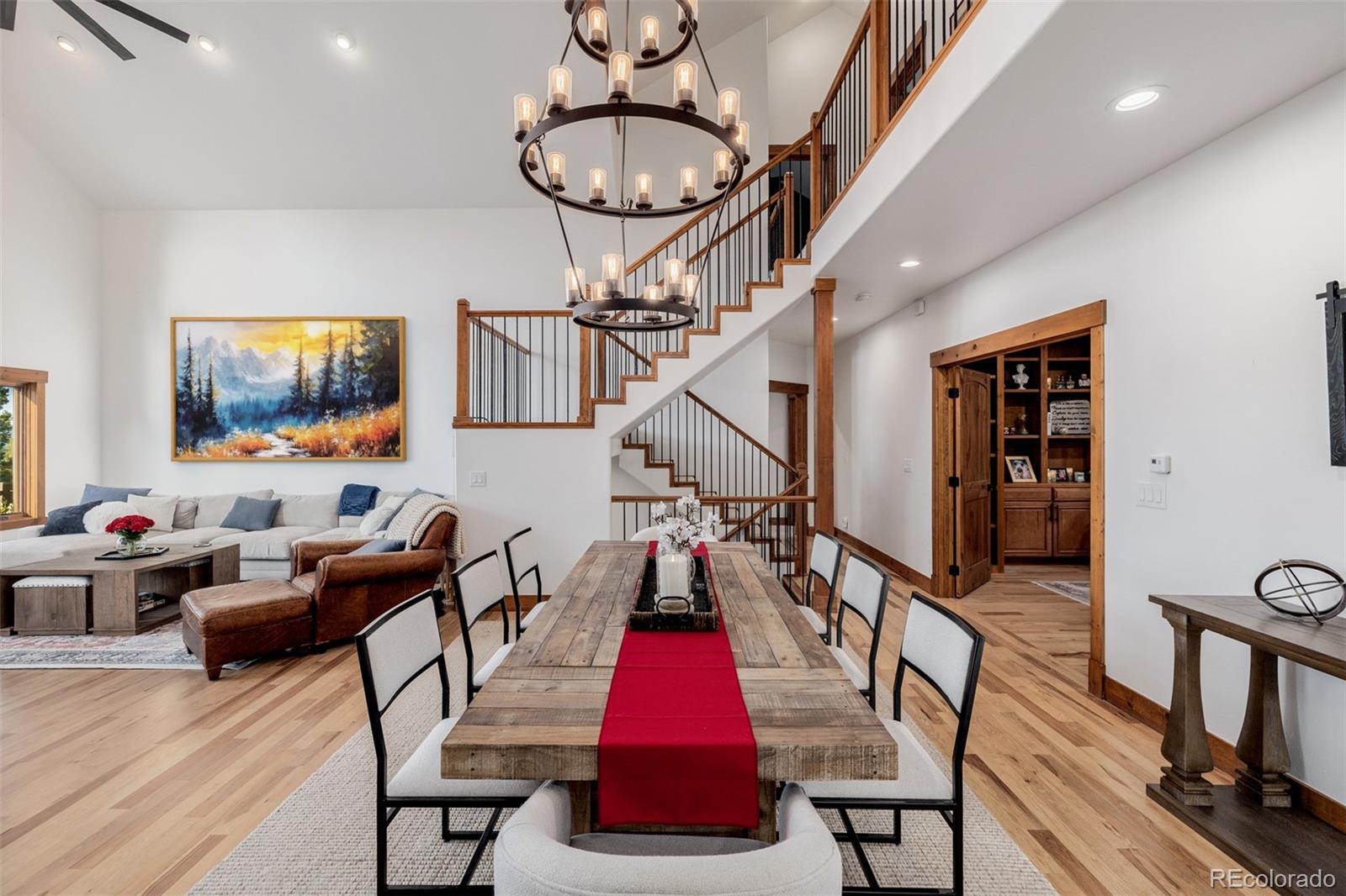 11272 Belle Meade Drive Conifer, CO 80433 - Photo 13 of 45 a living room with furniture and a flat screen tv