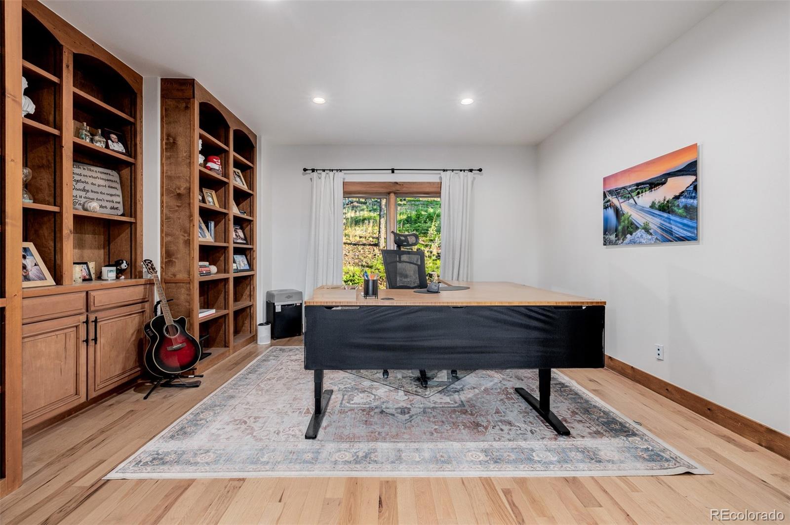 11272 Belle Meade Drive Conifer, CO 80433 - Photo 21 of 45 a room with furniture potted plant and a window