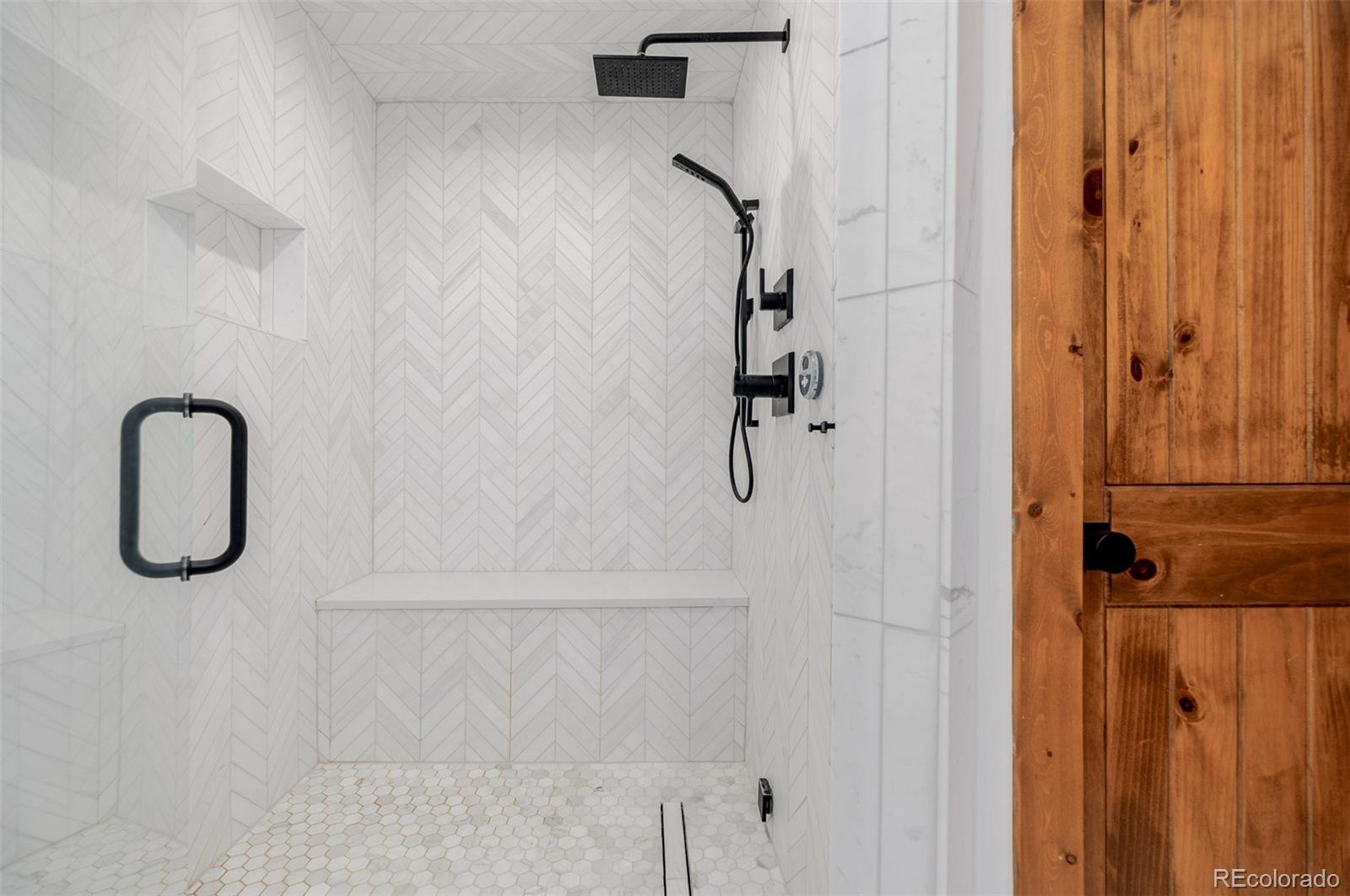 11272 Belle Meade Drive Conifer, CO 80433 - Photo 28 of 45 a bathroom with a shower