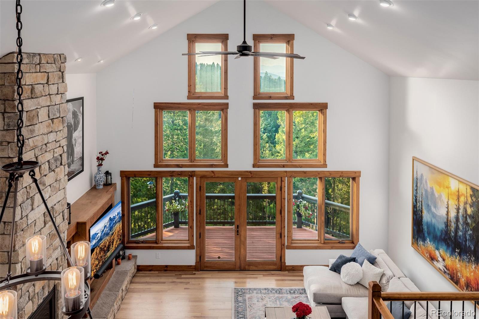 11272 Belle Meade Drive Conifer, CO 80433 - Photo 29 of 45 a view of a living room with windows