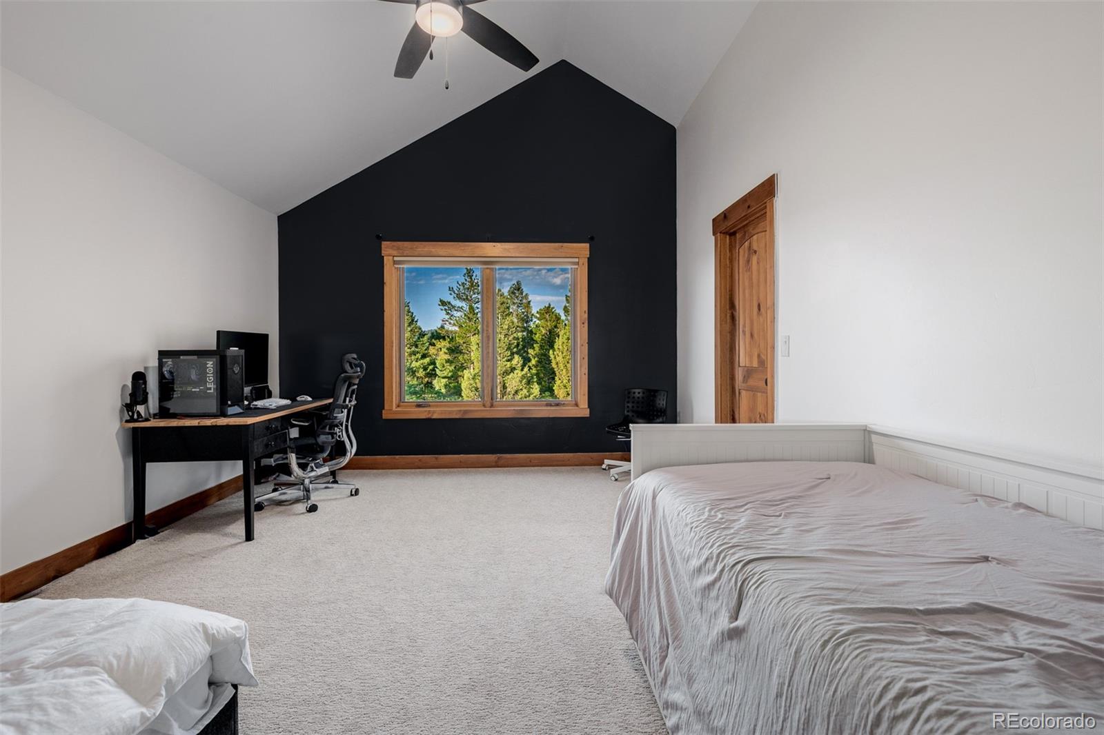 11272 Belle Meade Drive Conifer, CO 80433 - Photo 30 of 45 a bed room with a bed and a window