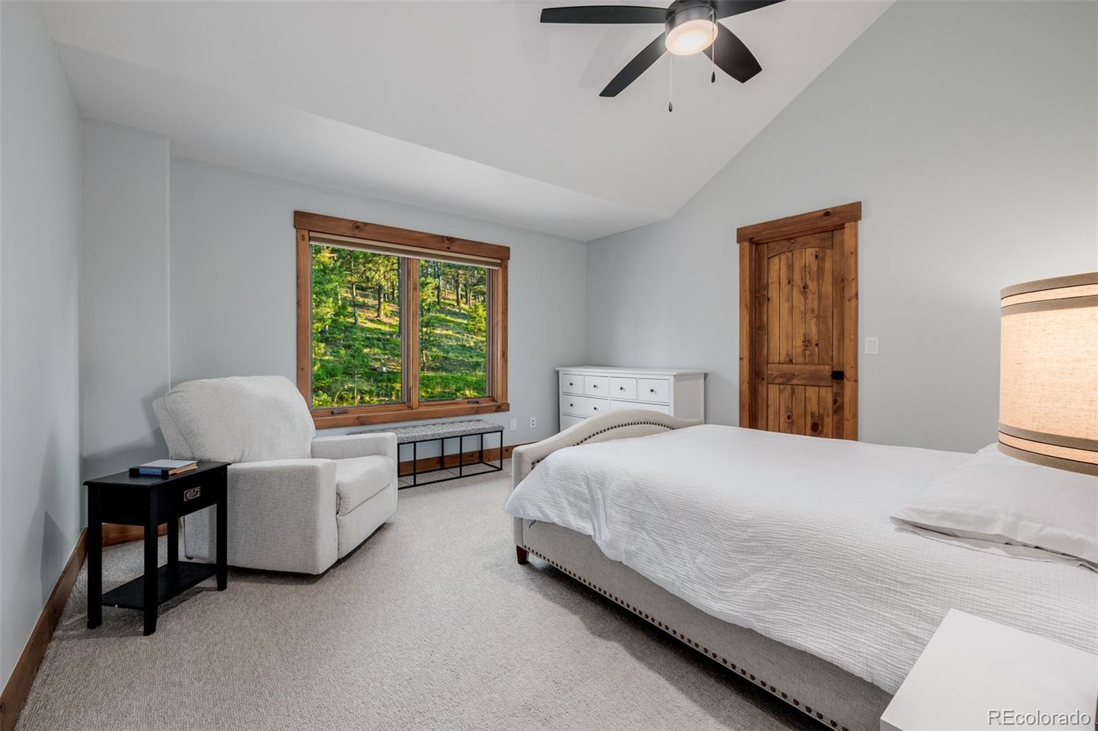 11272 Belle Meade Drive Conifer, CO 80433 - Photo 32 of 45 a bedroom with a bed and a window