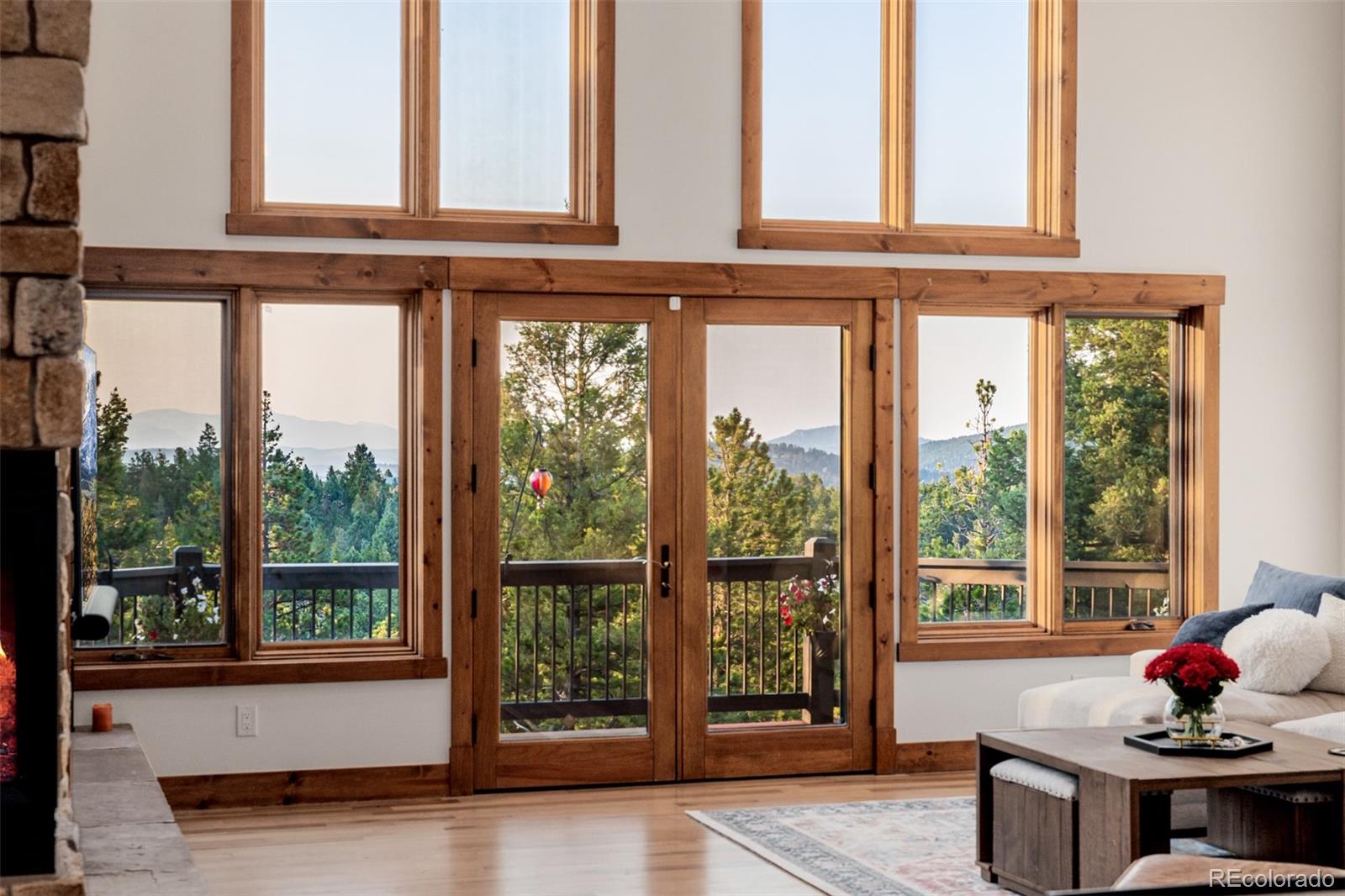 11272 Belle Meade Drive Conifer, CO 80433 - Photo 4 of 45 a living room with furniture and large window