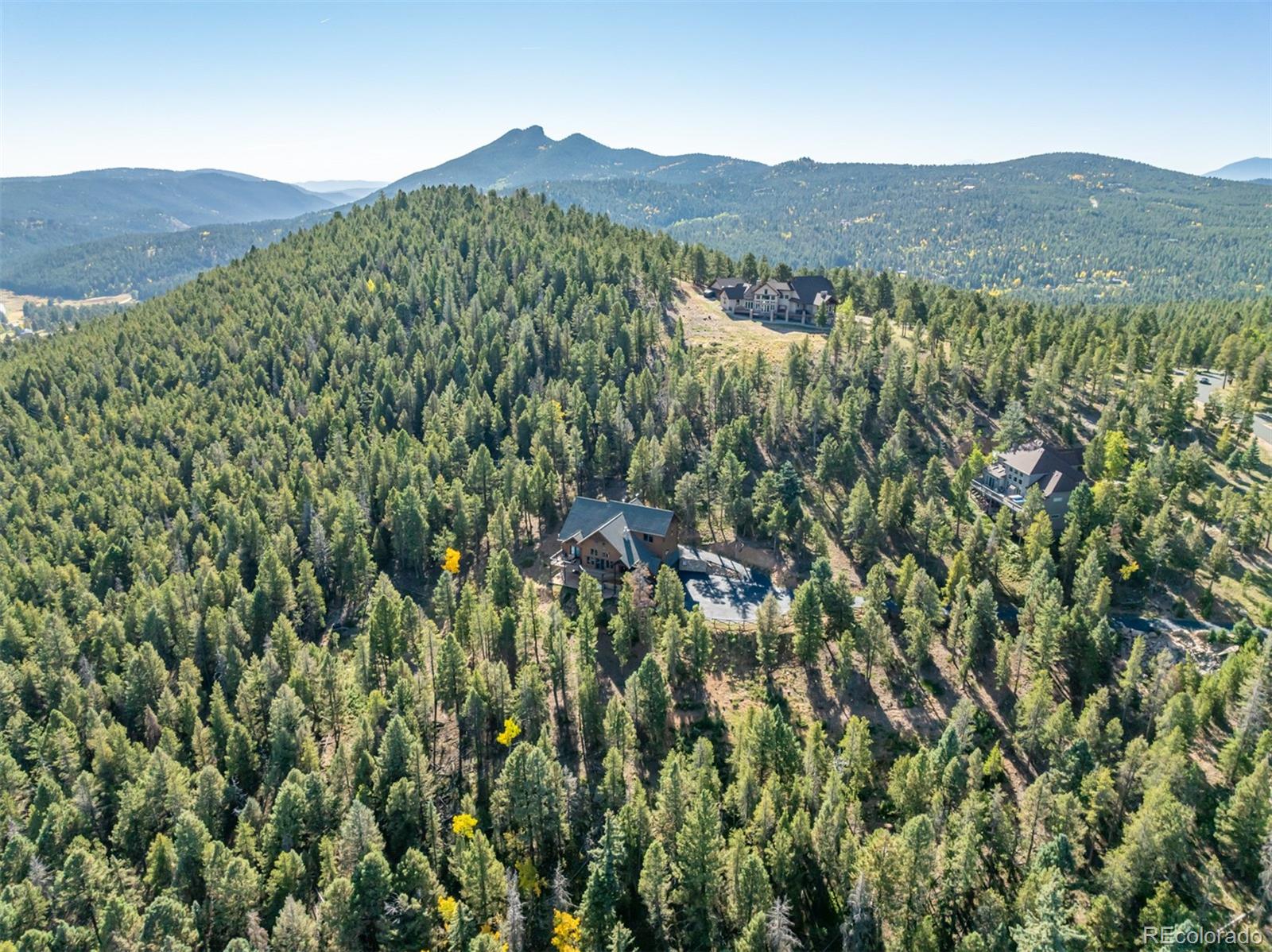 11272 Belle Meade Drive Conifer, CO 80433 - Photo 44 of 45 a view of a lush green hillside and mountains