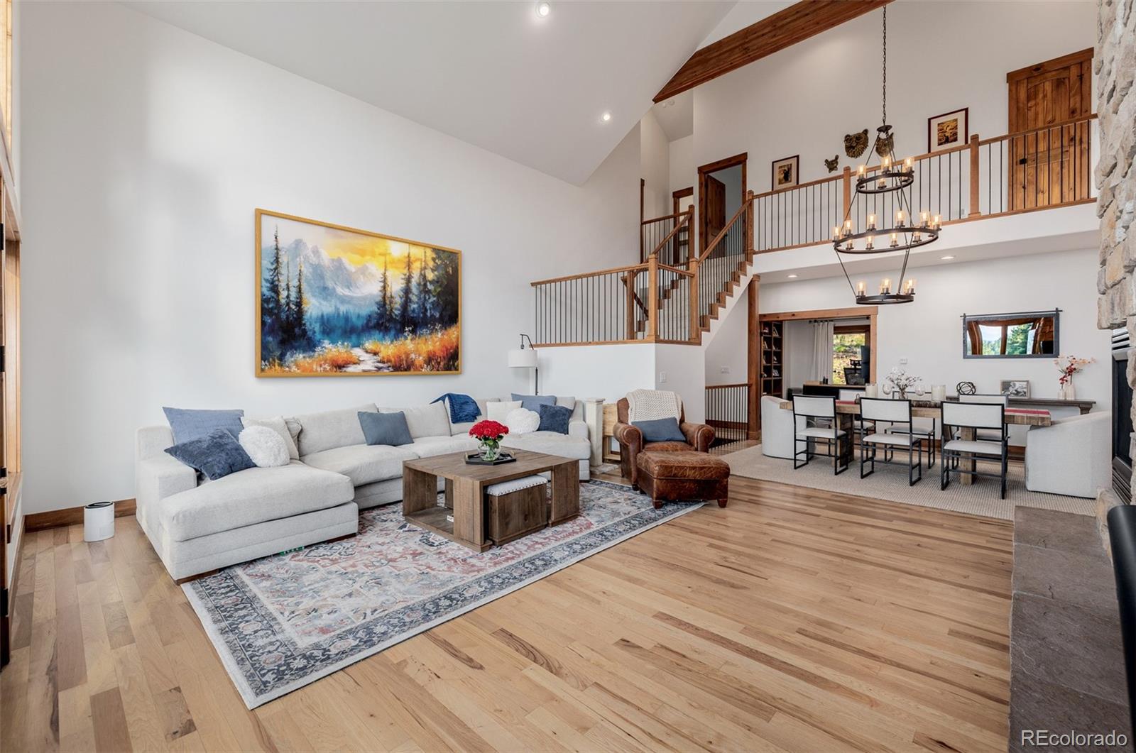 11272 Belle Meade Drive Conifer, CO 80433 - Photo 6 of 45 a living room with furniture and wooden floor