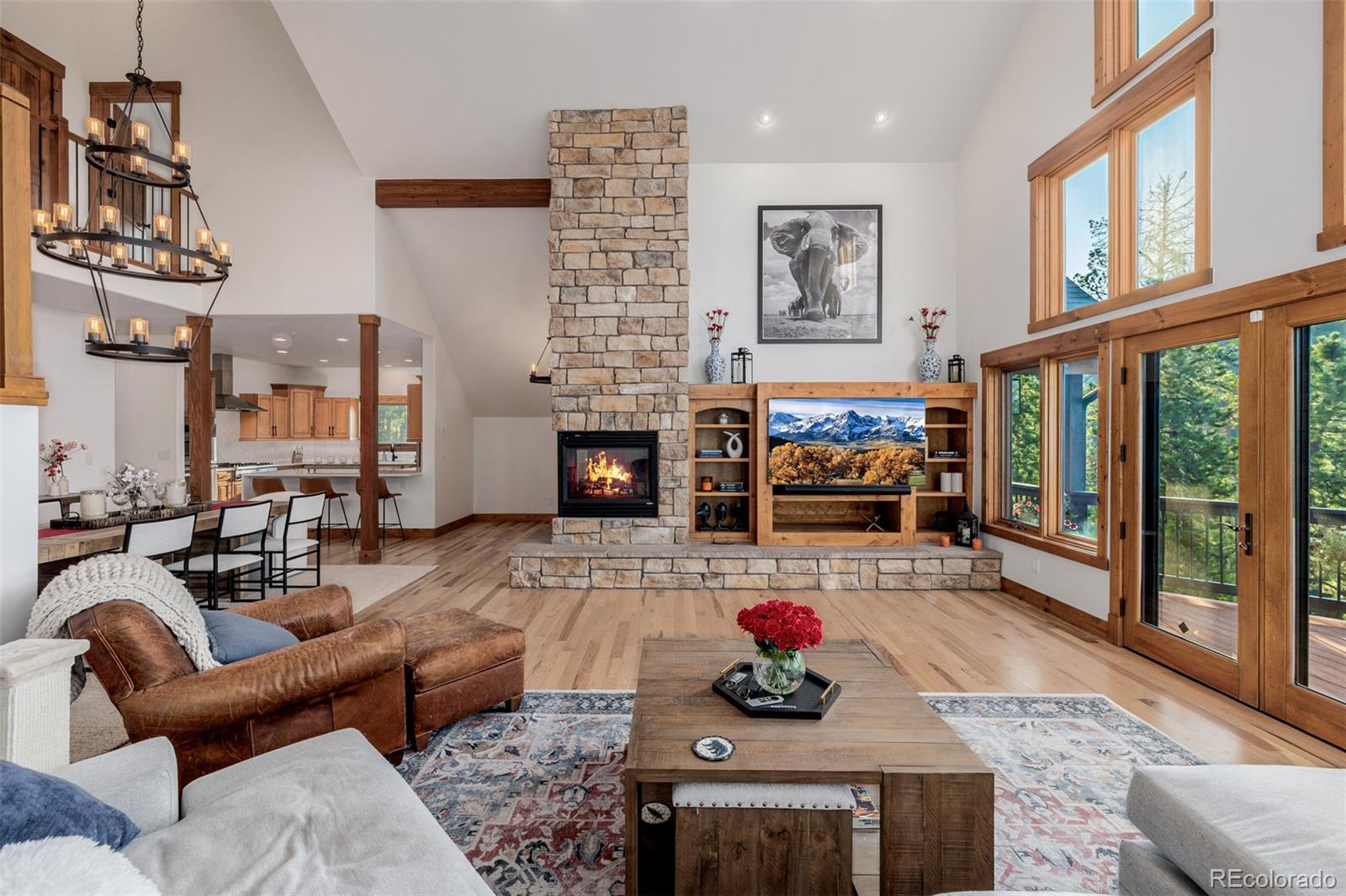 11272 Belle Meade Drive Conifer, CO 80433 - Photo 7 of 45 a living room with furniture fireplace and flat screen tv