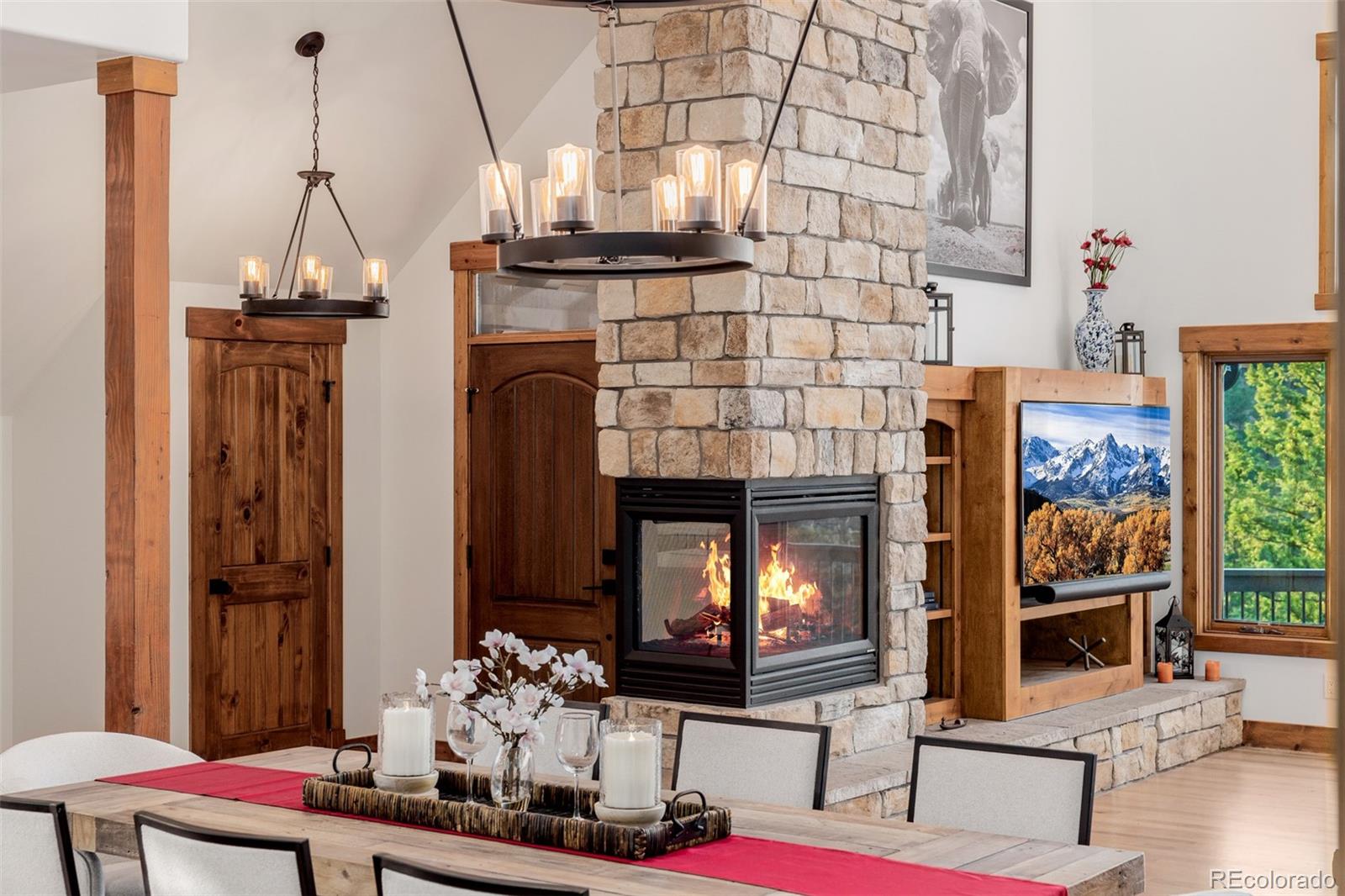 11272 Belle Meade Drive Conifer, CO 80433 - Photo 9 of 45 a living room with furniture and a fireplace