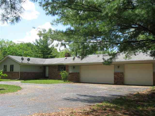 14172 Hauley Road Durand, IL 61024 - Photo 1 of 9 a front view of a house with a yard and garage