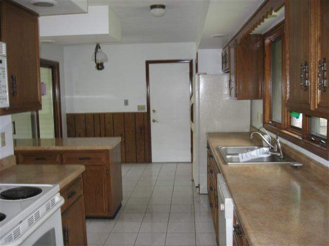14172 Hauley Road Durand, IL 61024 - Photo 5 of 9 a kitchen with a sink stove and refrigerator