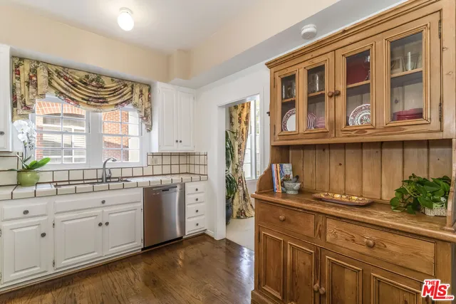 a kitchen with stainless steel appliances granite countertop a stove and a sink