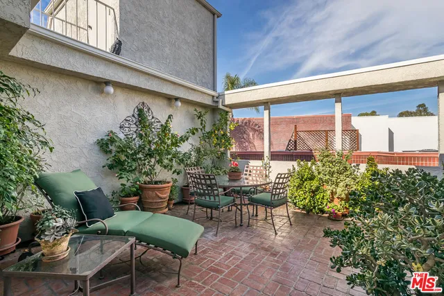 a couple of table and chairs in the patio