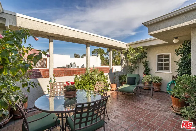 a outdoor dining space with furniture and garden