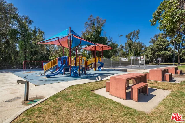 a view of a swimming pool with a lounge chair