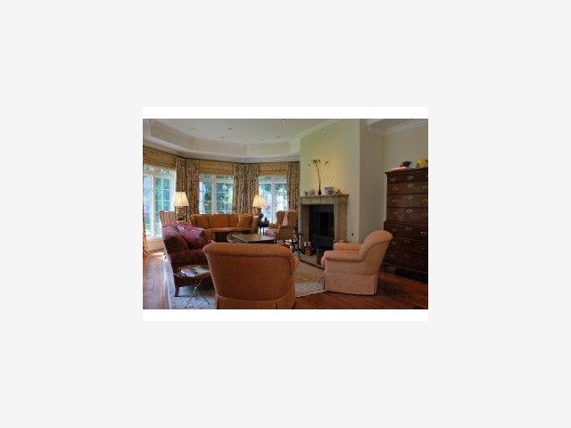 450 Middlefield Road Atherton, CA 94027 - Photo 7 of 9 a living room with furniture and a fireplace