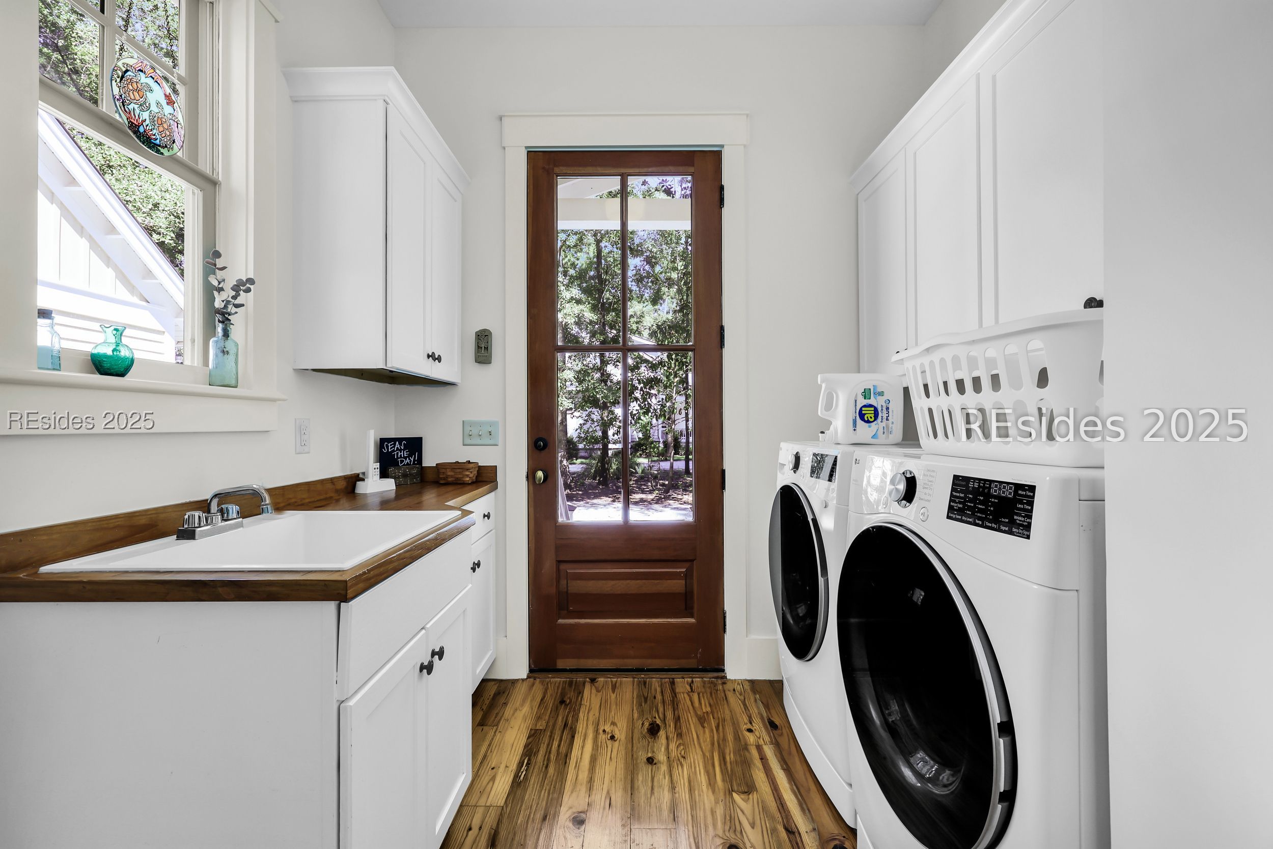 5 Oldfield Village Road Bluffton, SC 29909 - Photo 43 of 64 Laundry room with W/D, sink, and cabinets.