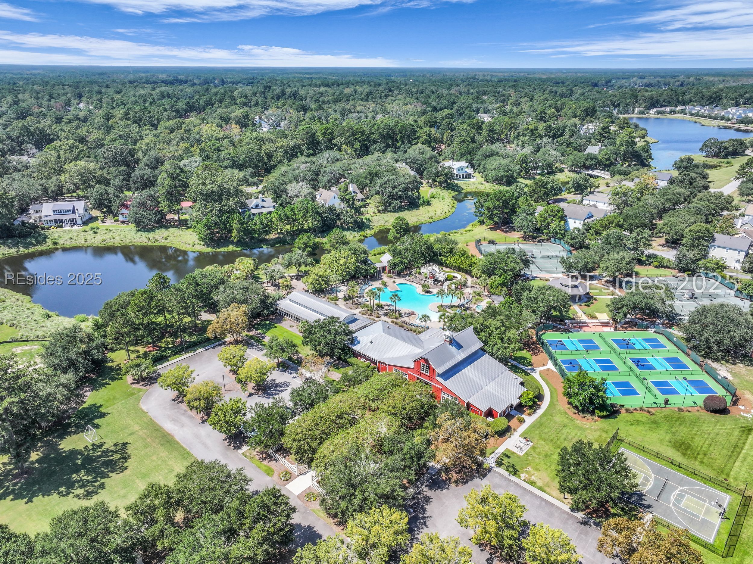 5 Oldfield Village Road Bluffton, SC 29909 - Photo 59 of 64 Community amenity center with pool, sports courts.