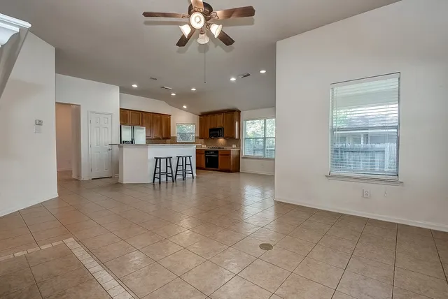 a kitchen with stainless steel appliances a refrigerator sink and microwave