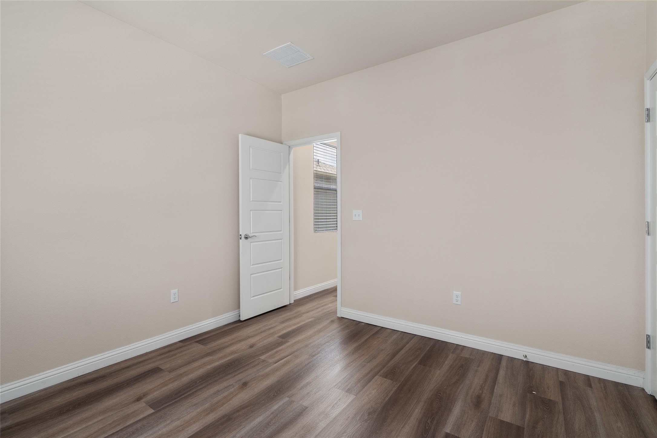 6907 Idea Road Austin, TX 78741 - Photo 24 of 36 a view of an empty room with wooden floor
