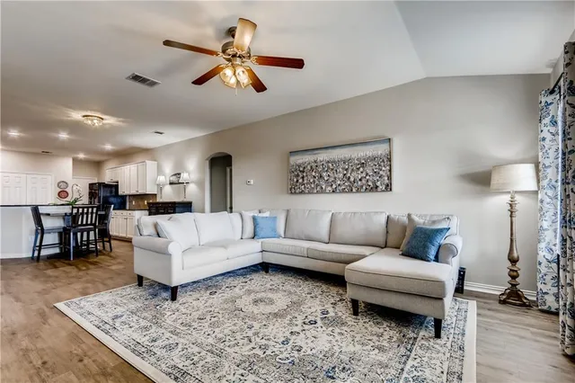 a living room with furniture and a rug