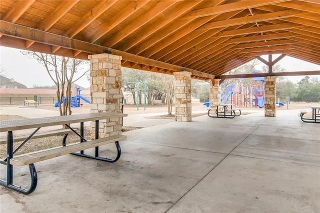 a view of a swimming pool with a patio
