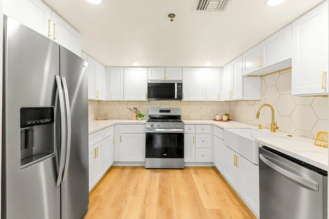 a bathroom with a sink and cabinets