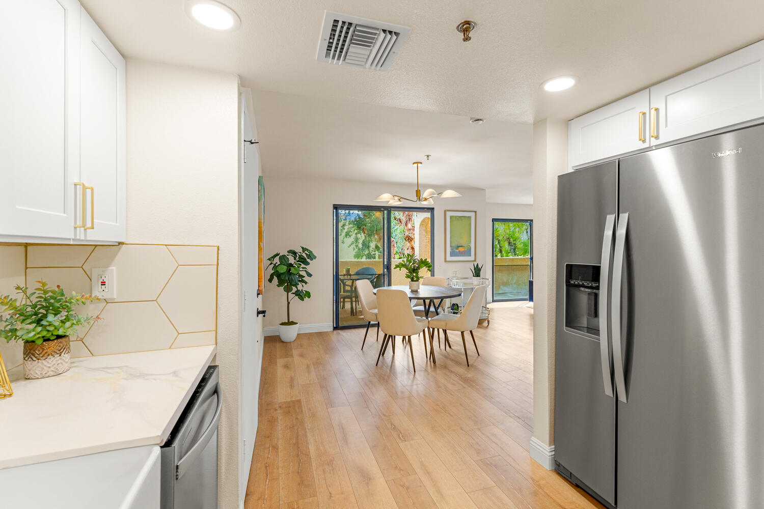 200 East Racquet Club Road, Unit 60 Palm Springs, CA 92262 - Photo 19 of 48 a kitchen with a table and chairs
