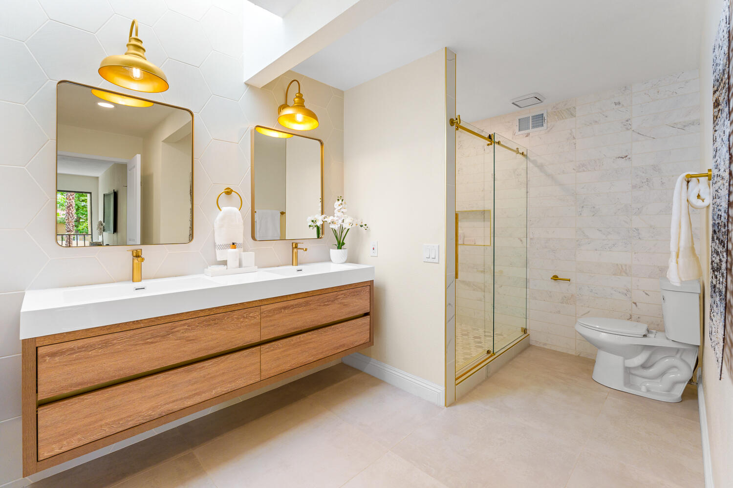 200 East Racquet Club Road, Unit 60 Palm Springs, CA 92262 - Photo 28 of 48 a bathroom with a double vanity sink toilet and shower