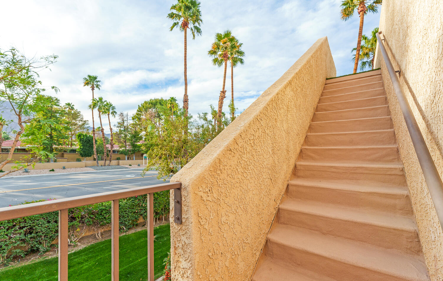 200 East Racquet Club Road, Unit 60 Palm Springs, CA 92262 - Photo 32 of 48 a view of staircase with sky view