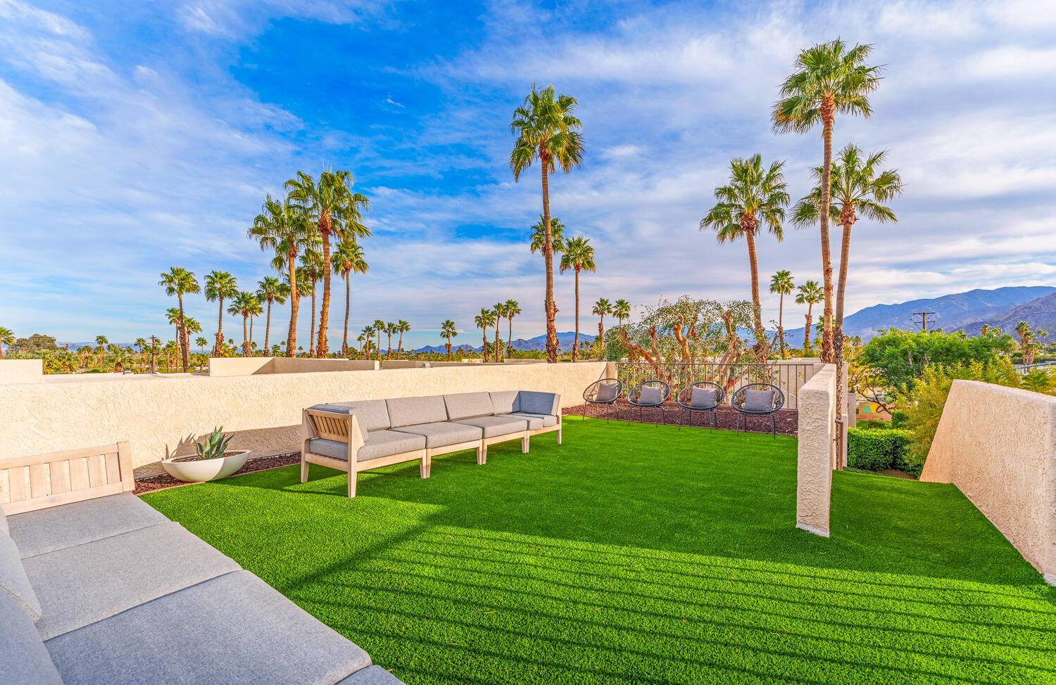 200 East Racquet Club Road, Unit 60 Palm Springs, CA 92262 - Photo 33 of 48 a view of a garden with a bench in the garden