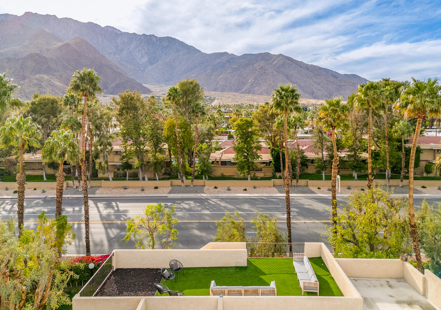 200 East Racquet Club Road, Unit 60 Palm Springs, CA 92262 - Photo 44 of 48 a view of a swimming pool with a garden