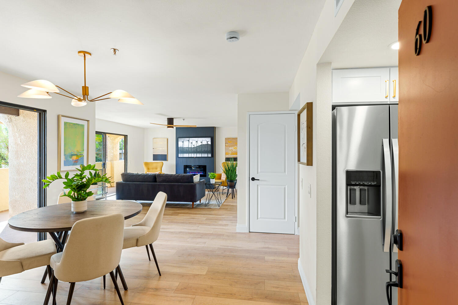 200 East Racquet Club Road, Unit 60 Palm Springs, CA 92262 - Photo 6 of 48 a view of a dining room with furniture window and wooden floor