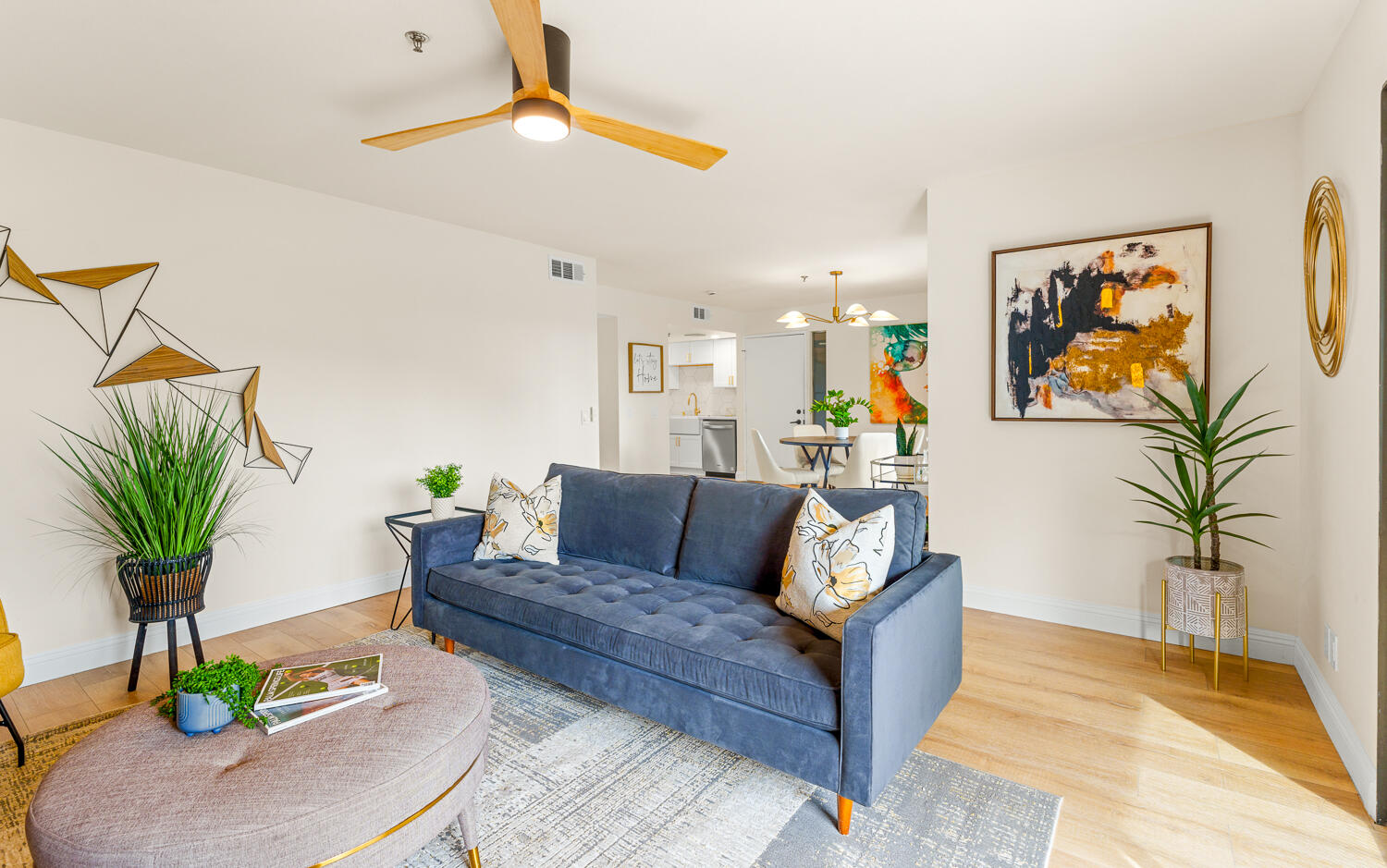 200 East Racquet Club Road, Unit 60 Palm Springs, CA 92262 - Photo 10 of 48 a living room with furniture a potted plant and a rug