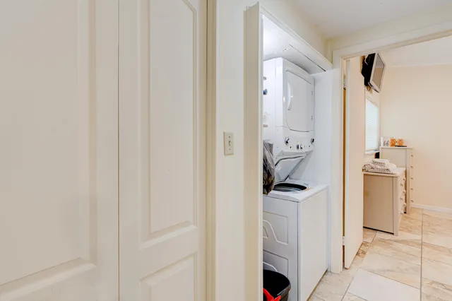 a view of empty room with a large window