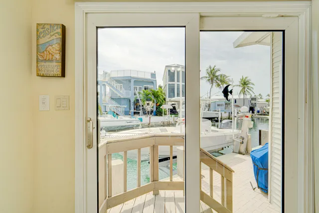 a kitchen with kitchen island a refrigerator stove and microwave